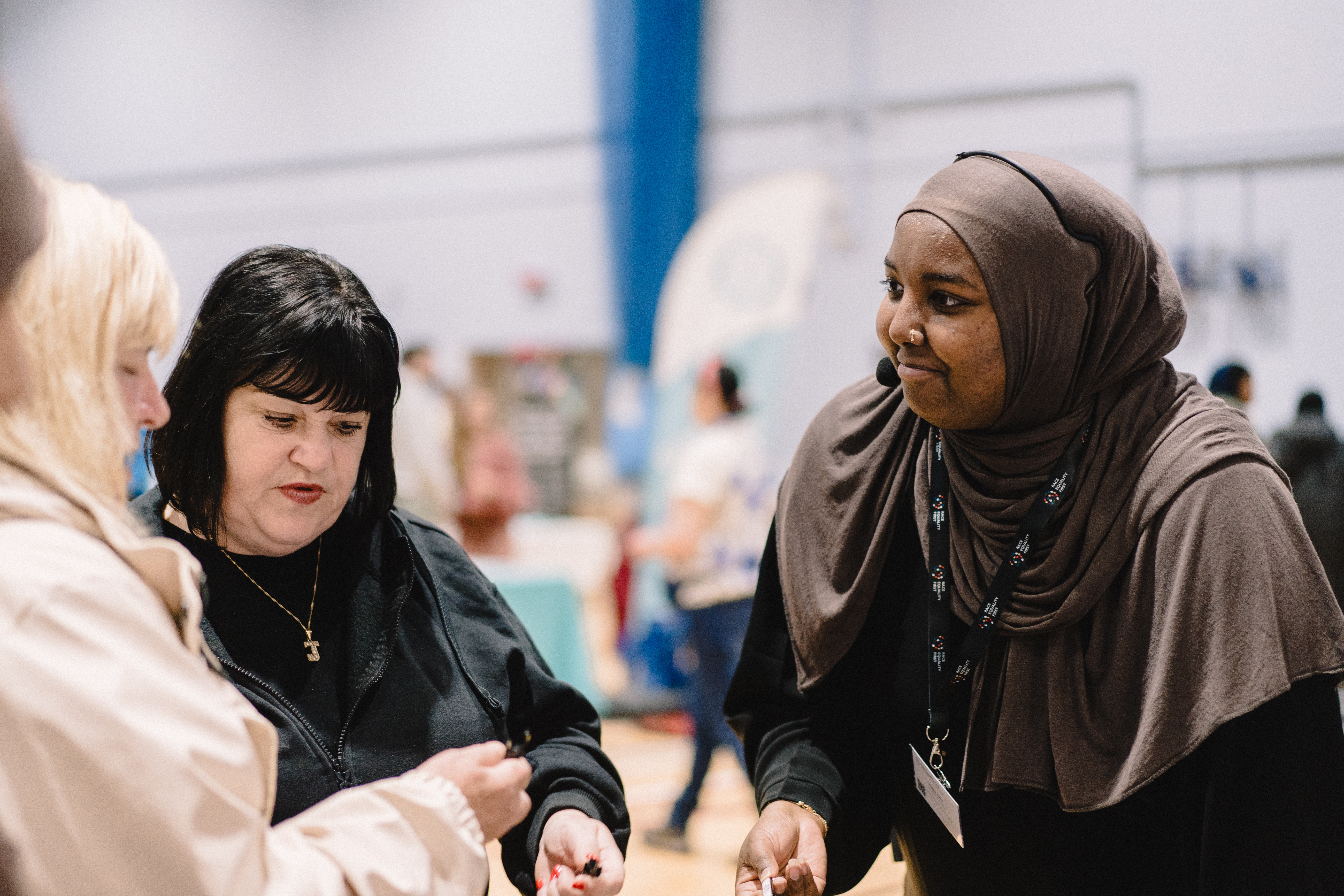 Halima talking to visitors at the fair